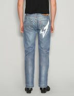 'Love Will Tear Us Apart' Jeans in Light Blue.