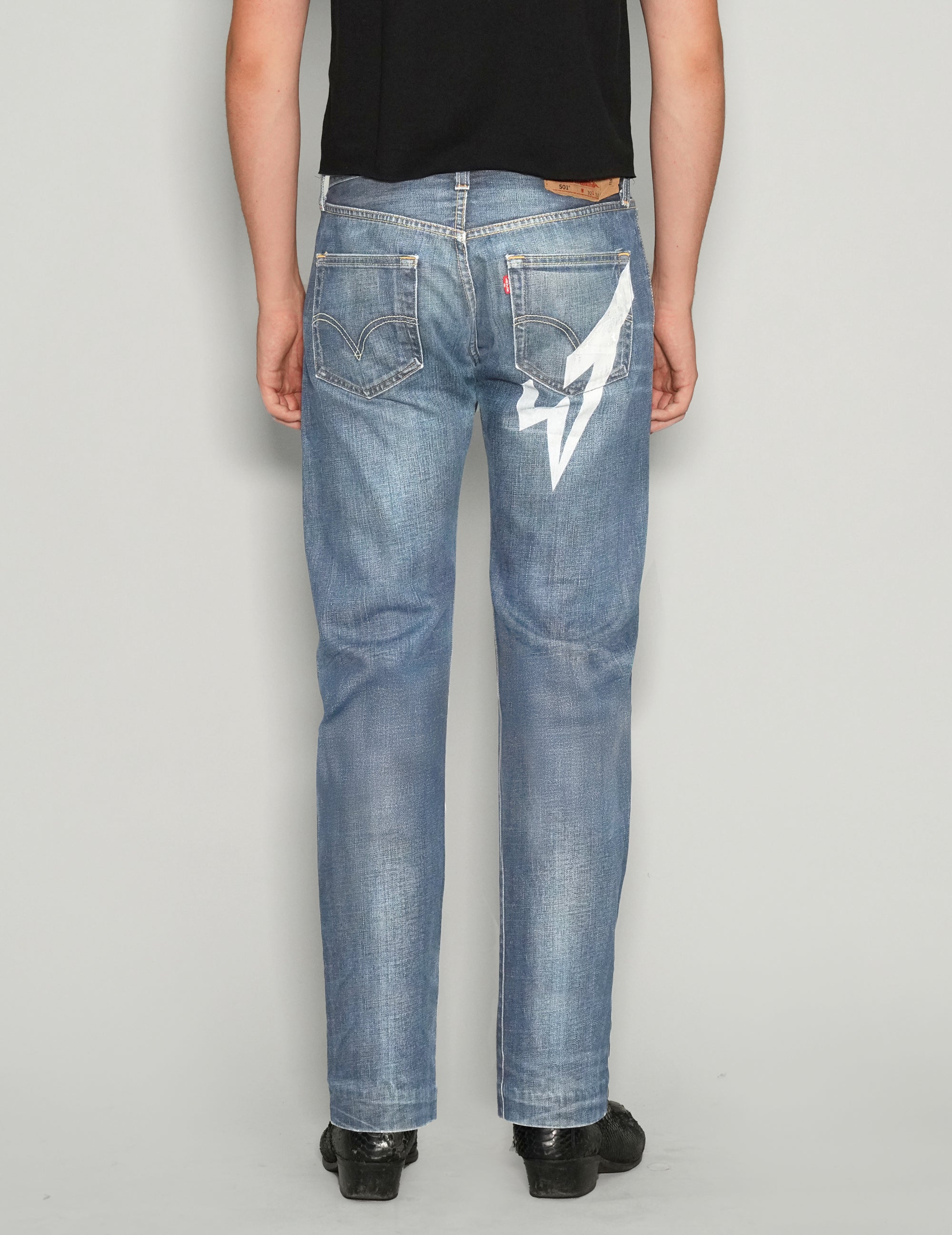 'Love Will Tear Us Apart' Jeans in Light Blue.