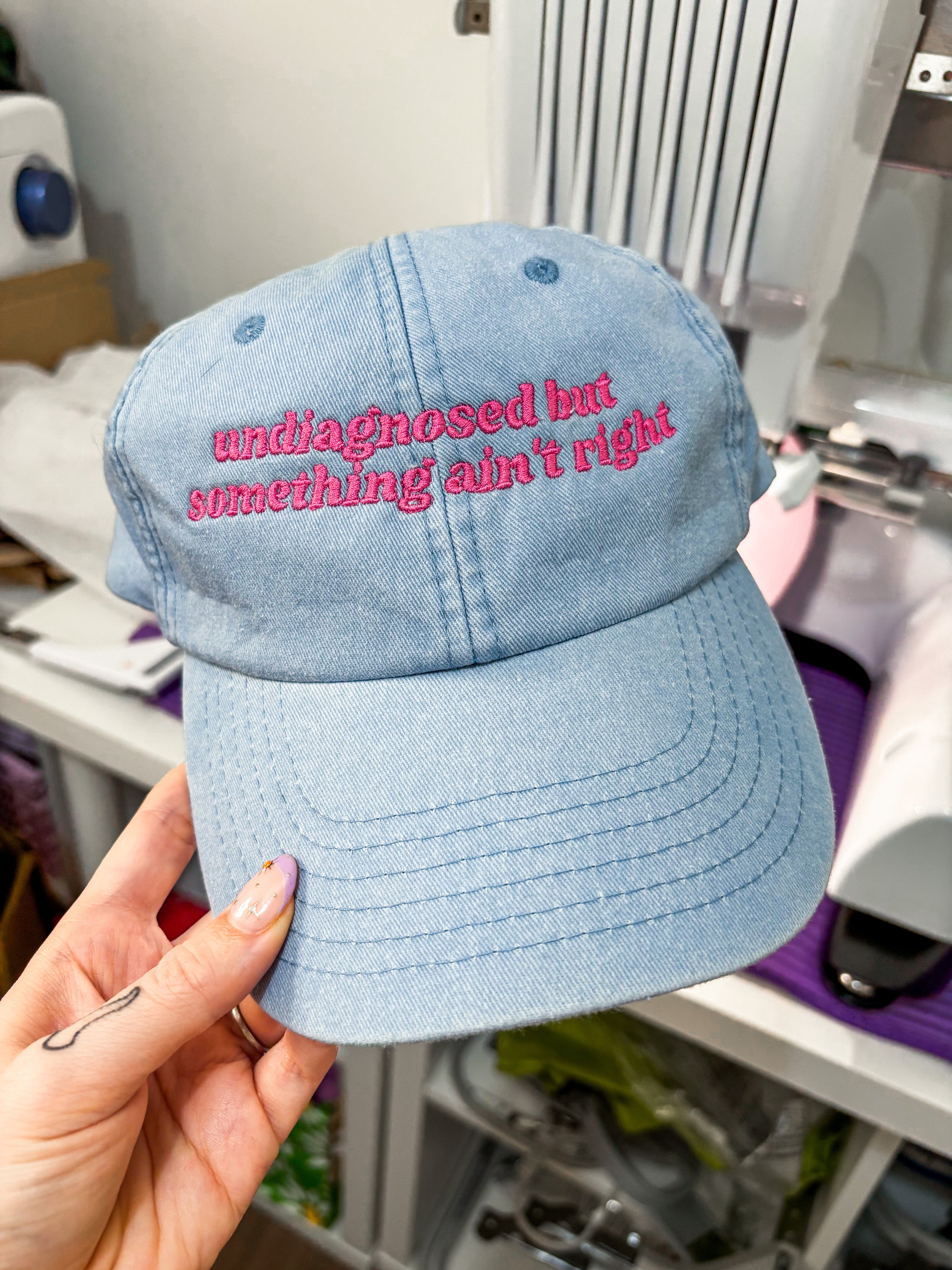 Undiagnosed But Something Ain't Right embroidered baseball cap.