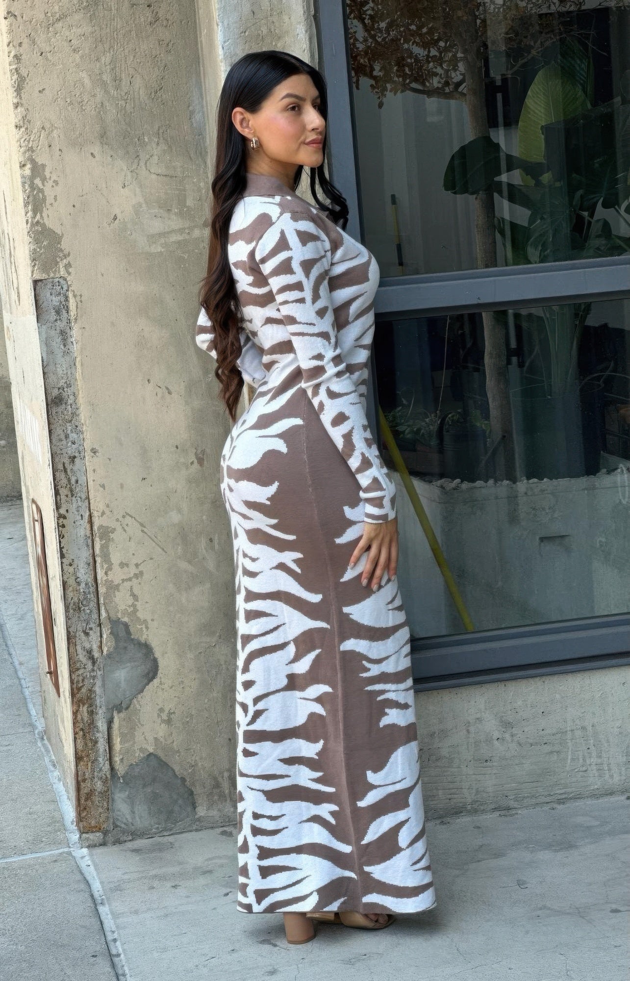 Elegant animal print sweater dress showcasing luxurious texture and sophisticated style for high-end fashion enthusiasts