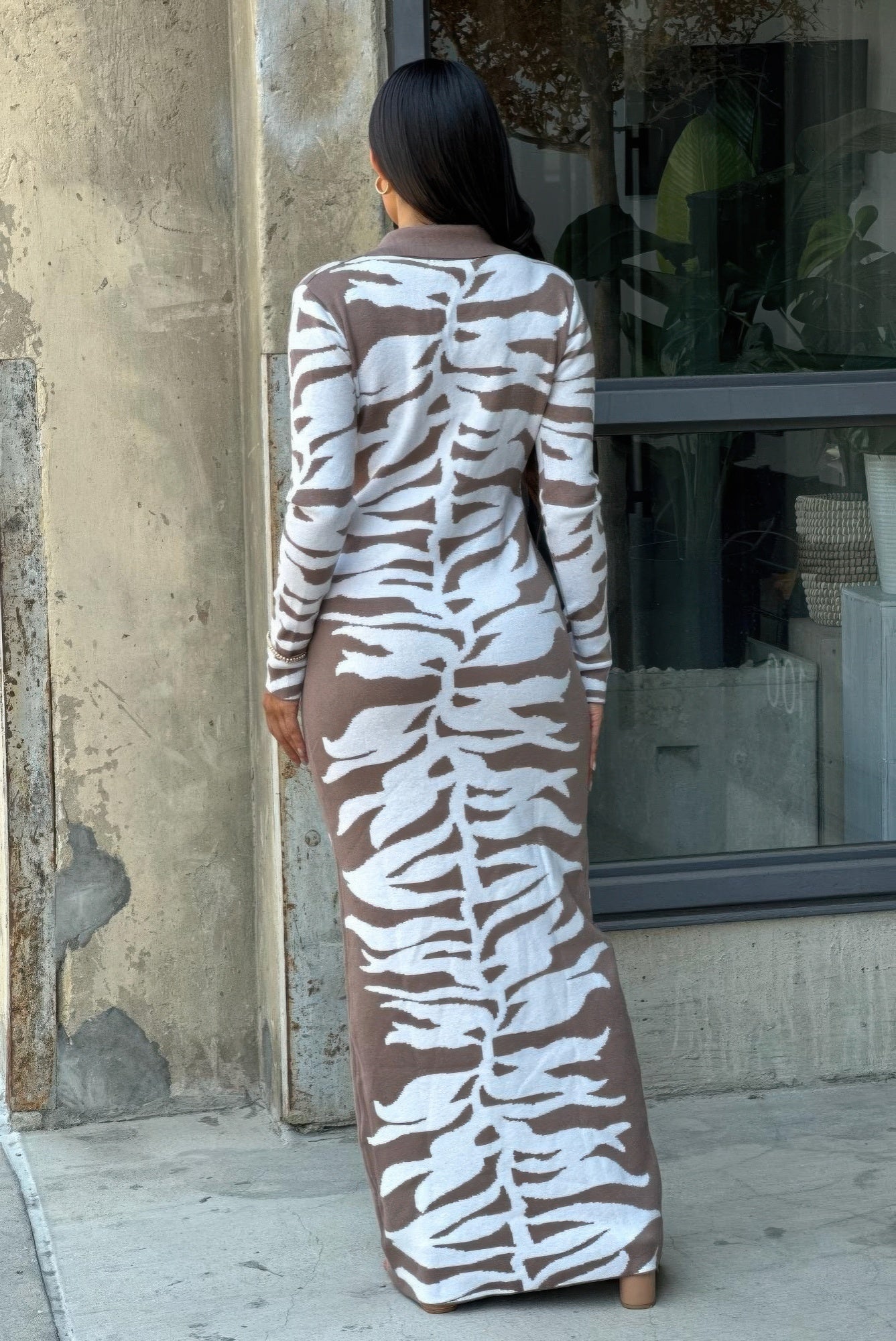 Elegant animal print sweater dress showcasing luxurious texture and sophisticated style for high-end fashion enthusiasts